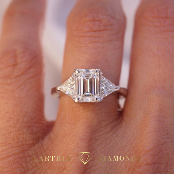 1Ct Emerald Cut Diamond With Triangle Cut Diamonds On The Sides Ring